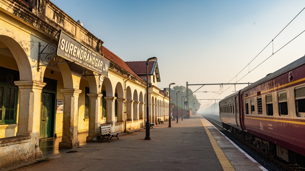 Colonial railway station building of Surendranagar Junction with a train on the platform